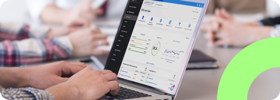 A person using a computer. The SEO dashboard of the Siteimprove platform is showing on the screen.